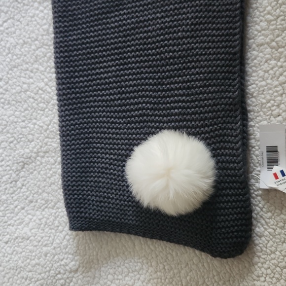 Brand new grey knitted with fur ball